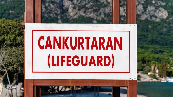 Lifeguard signboard in Turkish language reading Cankurtaran and English translation in Mediterranean town of Marmaris, Turkey