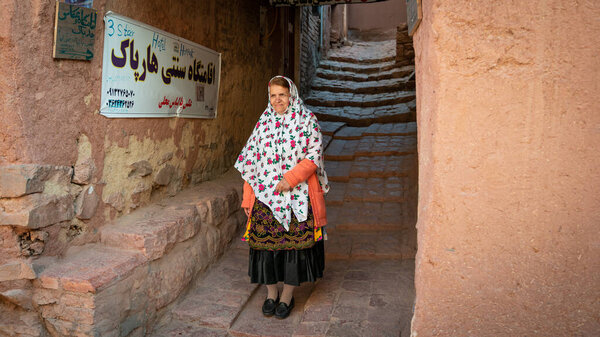 Abyaneh, Iran - May 2019: Woman with traditional Abyaneh Persian dress