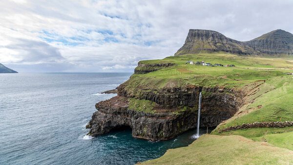 Mulafossur waterfall in Gasadalur, Vagar Island of Faroe Islands.