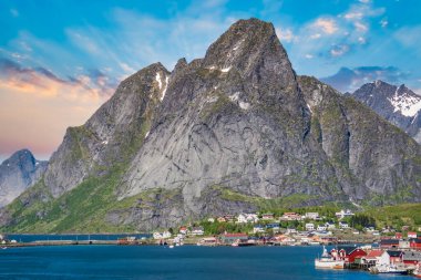 Reine, Lofoten, Norway - June 2016: The village of Reine under a sunny, blue sky, with the typical rorbu houses