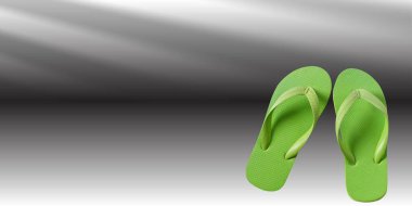 yeşil arkaplanda bir yaprak ile parmak arası terlikler