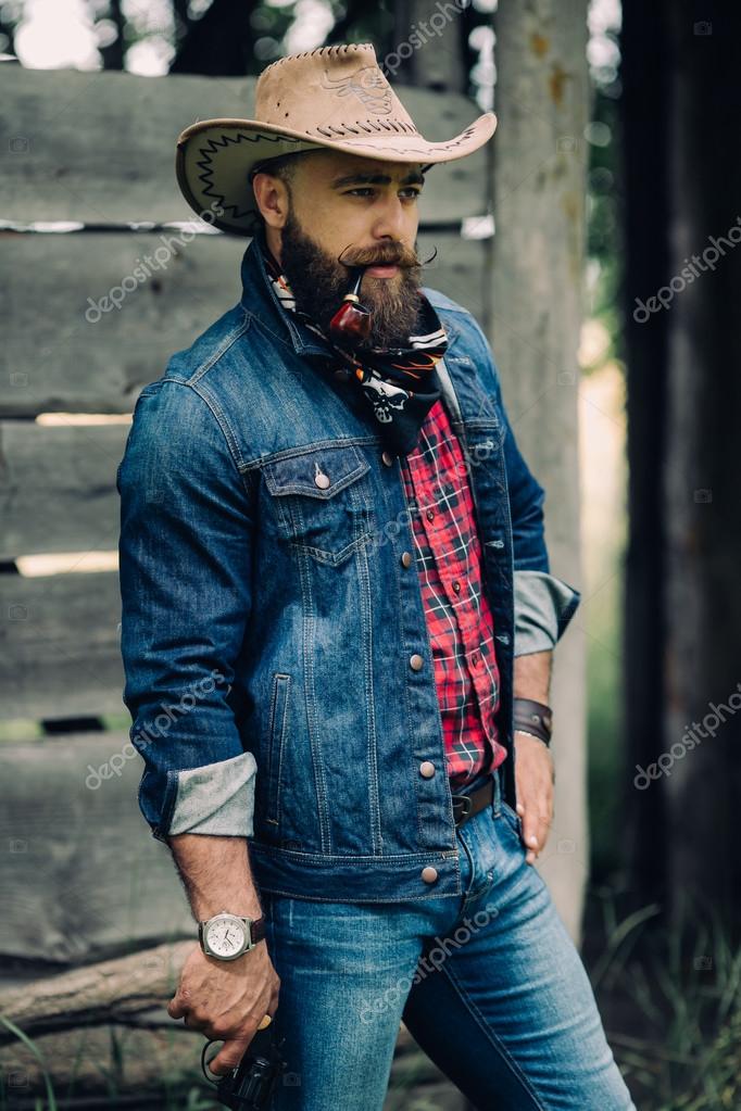 Bearded cowboy with gun — Stock Photo © anatoliycherkas