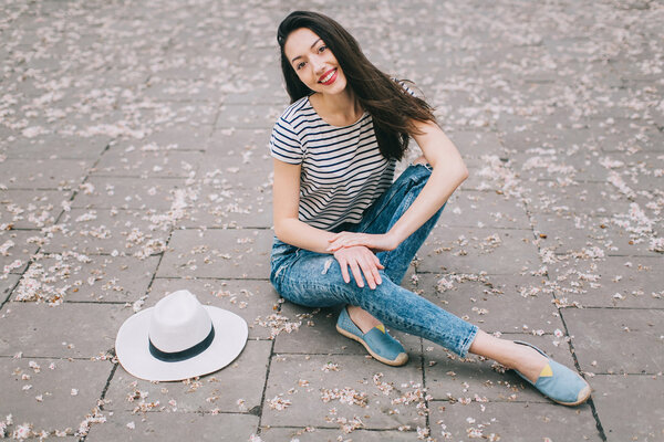 girl sitting on street