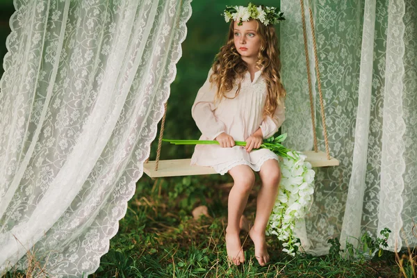 Little girl swinging — Stock Photo, Image