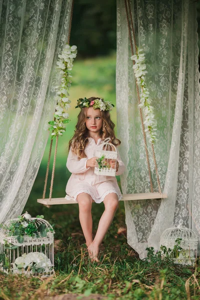 Little girl swinging — Stock Photo, Image