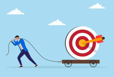 Bir işadamının büyük bir hedef levhasını bir halatla çekmesinin vektör çizimi, kararlılığı, çabayı, hedef başarısını ve ticarette istikrarlı ilerlemeyi temsil ediyor.