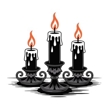 Yarasa şekilli şamdanları olan üç siyah mum.