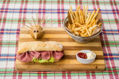 Ham sandwich with fried potatoes, ketchup and mayonnaise. clipart