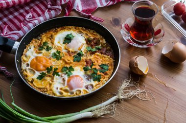 Turkish Breakfast Menemen / Omelette (Fried Eggs) with Tea. clipart