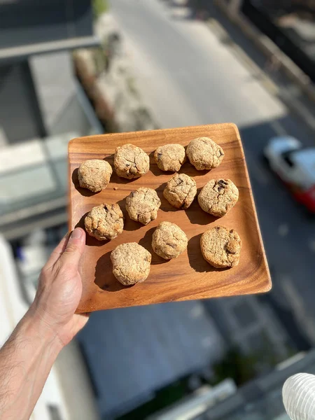 Homemade Organic Paleo Cookies Wooden Plate Holding Hand Pronto Para — Fotografia de Stock