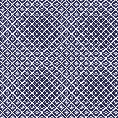 Tekrarlayan koyu mavi desenli kareler 45 derecelik açıyla döndürülmüş her karenin içinde çiçek motifli bir kare oluşturan beyaz çizgiler vardır.