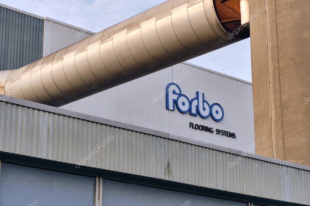 Assendelft, Netherlands; October 19, 2025: Forbo Flooring Systems linoleum factory with visible company logo and large exhaust ducts, illustrating Dutch industrial design and sustainable flooring production.