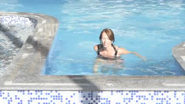 Woman coming out of the pool — Stock Video