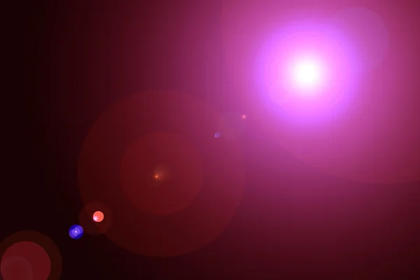 Dijital lens flare siyah arka plan yatay çerçeve sıcak ve soyut arka planda — Stok fotoğraf