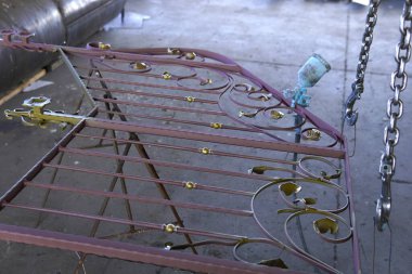 Decorative forged railings. Artistic metalwork with a floral pattern.