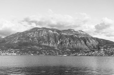 View of Taygetus Mountains seen from Kalamata Port waterfront in Peloponnese, Greece, in black and white