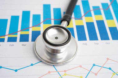 Çizelge üzerinde steteskop veya grafik kağıdı, Finansal, hesap, istatistik ve iş verileri tıbbi sağlığı.