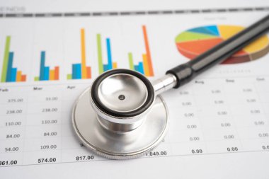 Çizelge üzerinde steteskop veya grafik kağıdı, Finansal, hesap, istatistik ve iş verileri tıbbi sağlığı.
