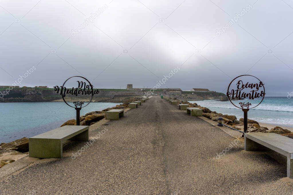 A signs on Palomas Island in Tarifa with the Mediterranenan Sea behind