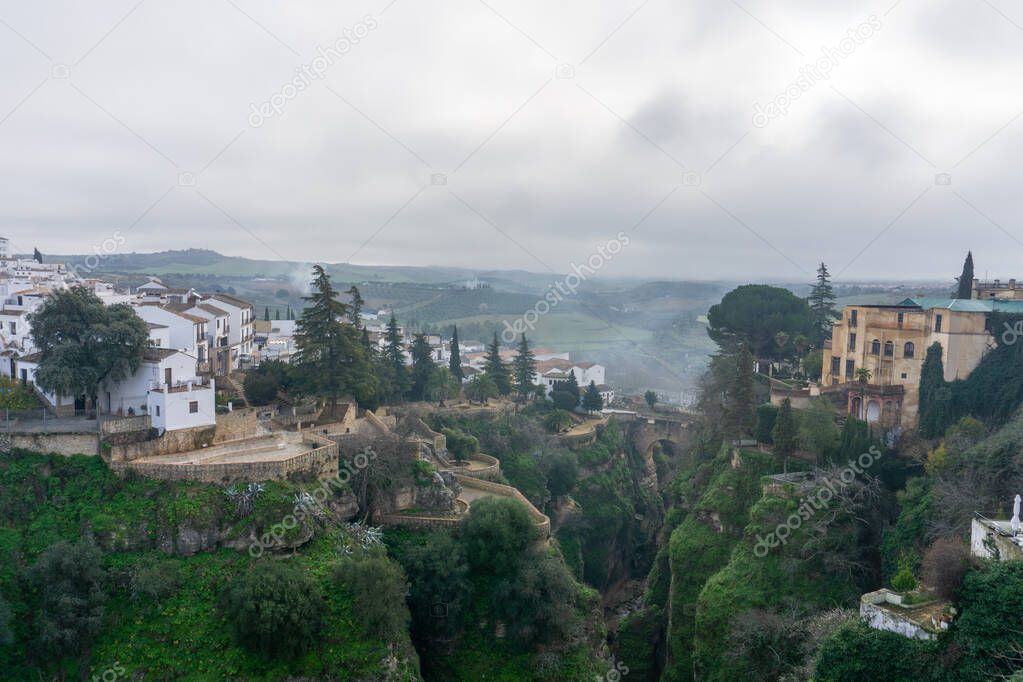 view of the narrow and deep El Tajo Gorge in Ronda in Andalusia