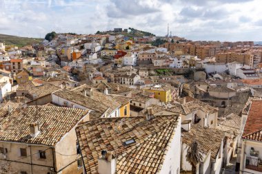 A view of the rooftops and colorful houses of the old city center of Cuenca clipart
