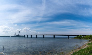 A view of the Faro bridge over the Storstrommen Sound in Denmark clipart