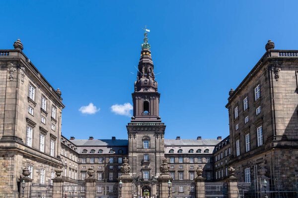 Copenhagen, Denmark - 13 June, 2021: view of the historic landmark Christiansborg Castle in downtown Copenhagen under a blue summer sky