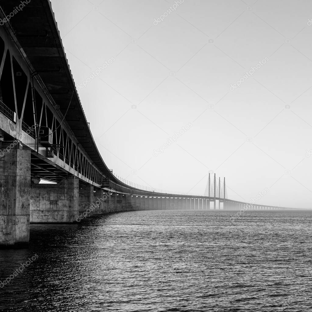 A black and white view of the Oresund Bridge between Denmark and Sweden