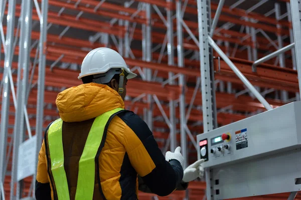 Maintenance technician service in cold warehouse storage, Machinery engineering people checking moving rack system and equipment in warehouse.