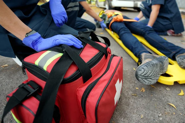 Emergency Medical First aid kit bags of first aid team service for an accident in work of worker loss of function in limbs, First aid training to transfer patient