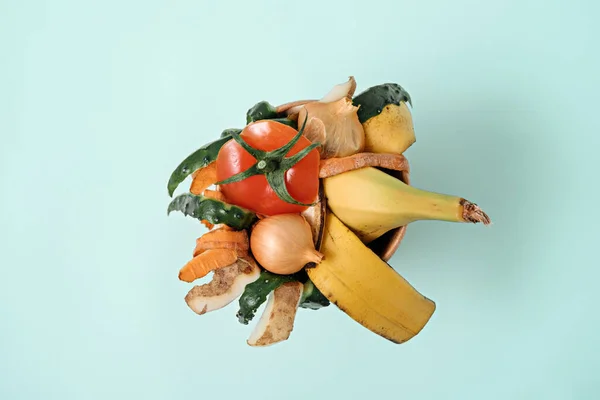 top view vegetable peeling on blue background, composting, Sustainable and zero waste