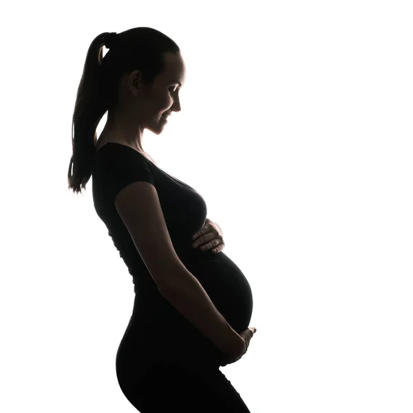 白地に笑顔の妊婦のシルエットの肖像 幸せな妊娠コンセプト — ストック写真