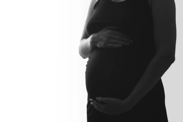 Close Barriga Grávida Com Mãos Silhueta Preto Branco Fundo Branco — Fotografia de Stock