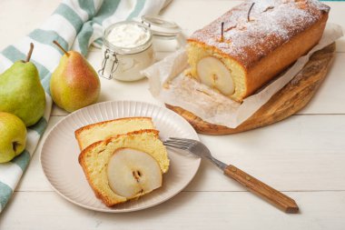 homemade pear cake on white background, pound cake with pear, seasonal dessert, closeup
