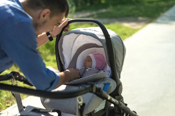 Father Day Concept Young Dad Takes Care Newborn Baby Stroller — Stok fotoğraf