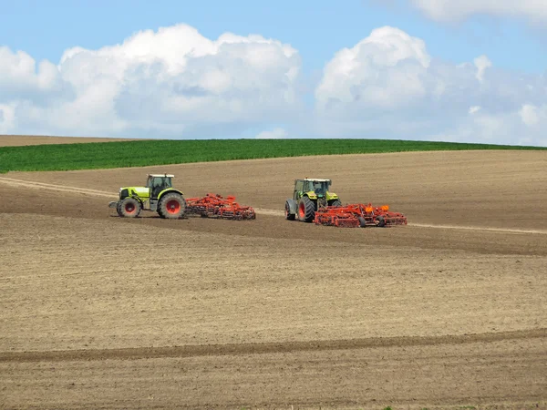 Mighty tractors and plowed fields — Stock Photo, Image