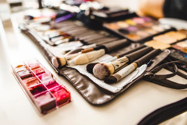 Makeup cosmetics and brushes on the table — Stock Photo, Image