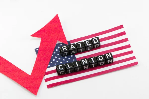 Clinton değerlendirme ifade bayrak arka plan üzerinde büyür — Stok fotoğraf