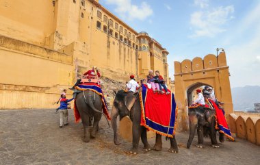 Tourist on elephant back on way to Amer Fort Jaipur