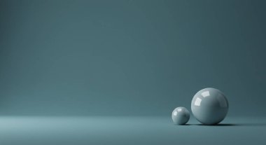Farklı boyutlarda iki pürüzsüz, açık mavi küre mavi-gri bir stüdyo zemininde ince bir gölgeyle dinleniyor..