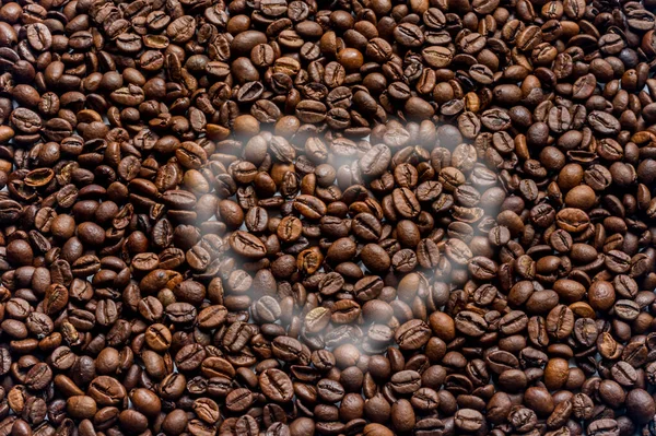 coffee beans texture background with smoke heart