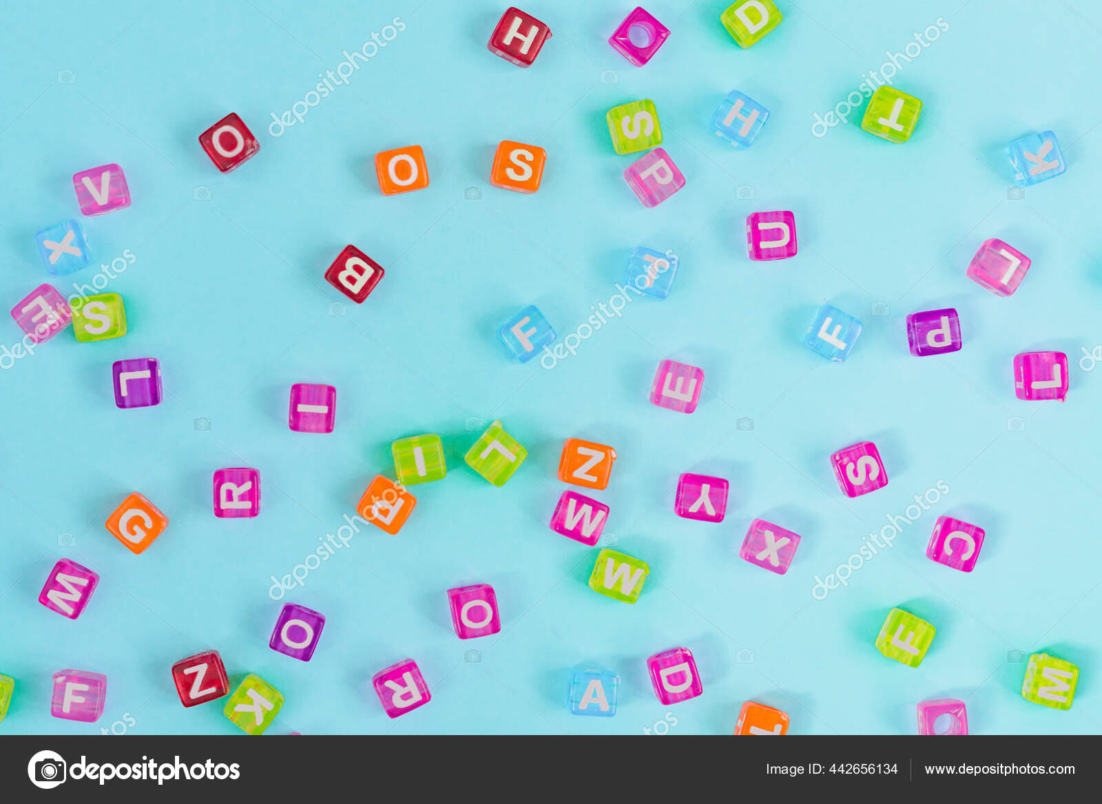 Multicolored Plastic Cube Beads Letters Scattered Blue Background Alphabet  Background Stock Photo by ©IKvyatkovskaya 442656134