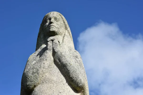 Statue of marie in front the port of Pornic