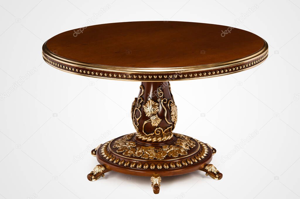 Luxury gold plated kitchen table in baroque style. Cut out, copy space