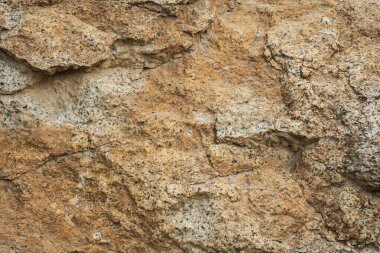 Kum ve toprak içeren doğal kayalık yüzey dokusu.