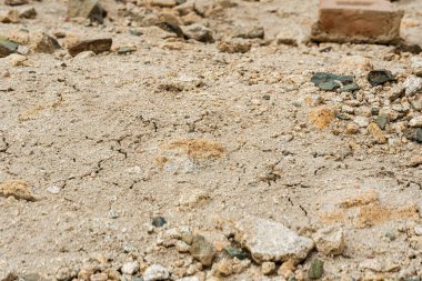 Kurumuş çamur yüzeyinin minimalist dokusu. Grafik tasarımı için dünyevi arkaplan.