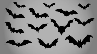 Bir grup uçan siyah yarasa siluetleri, Cadılar Bayramı ve ürkütücü dekorasyon elementleri..