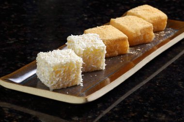 Mochi de Mandioca, a Japanese delicacy made with raw cassava, sugar, coconut milk, whole milk, and grated coconut.