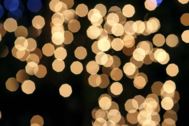 Siyah arkaplandaki renkli ve bulanık ışıkların dokusu.