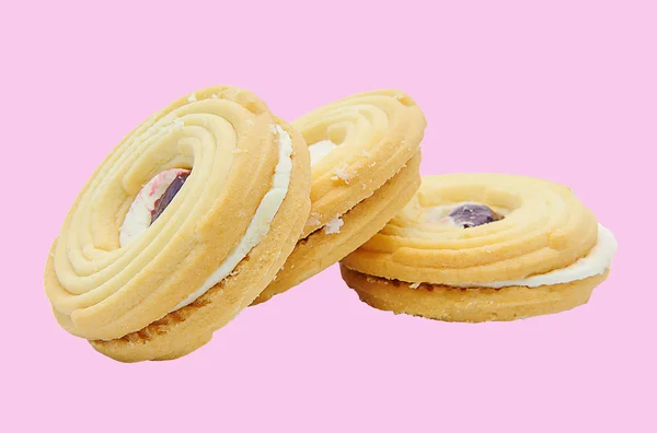 Cookies and vanilla cream isolated on a colorful background. — Stock Photo, Image